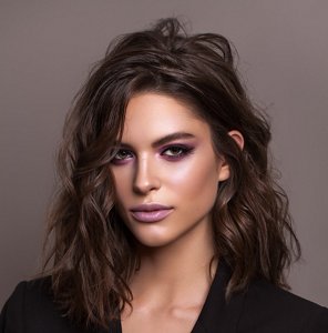 Elegant brunette woman with a kitty cut hairstyle